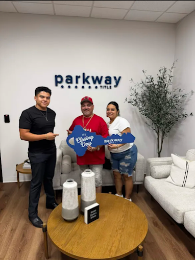 Marco Puga with clients on their closing day