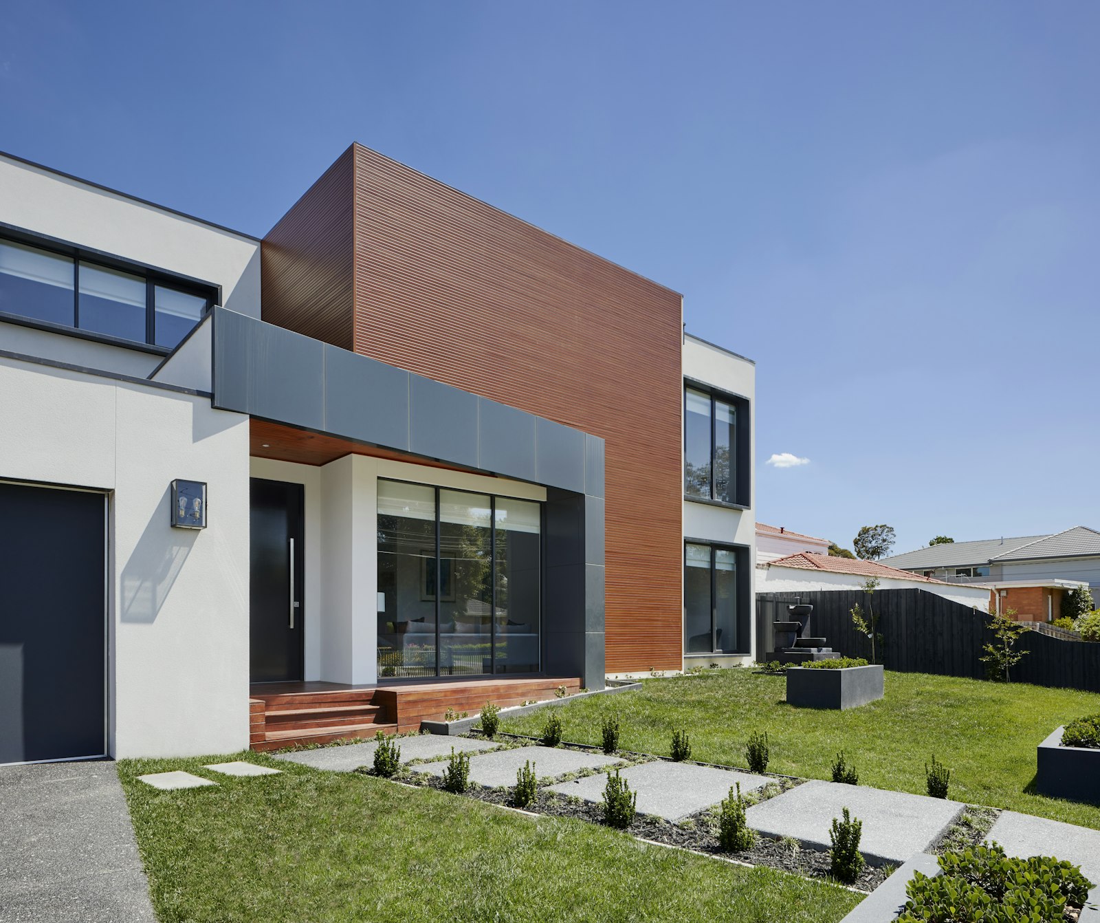 Modern home exterior with a landscaped walkway